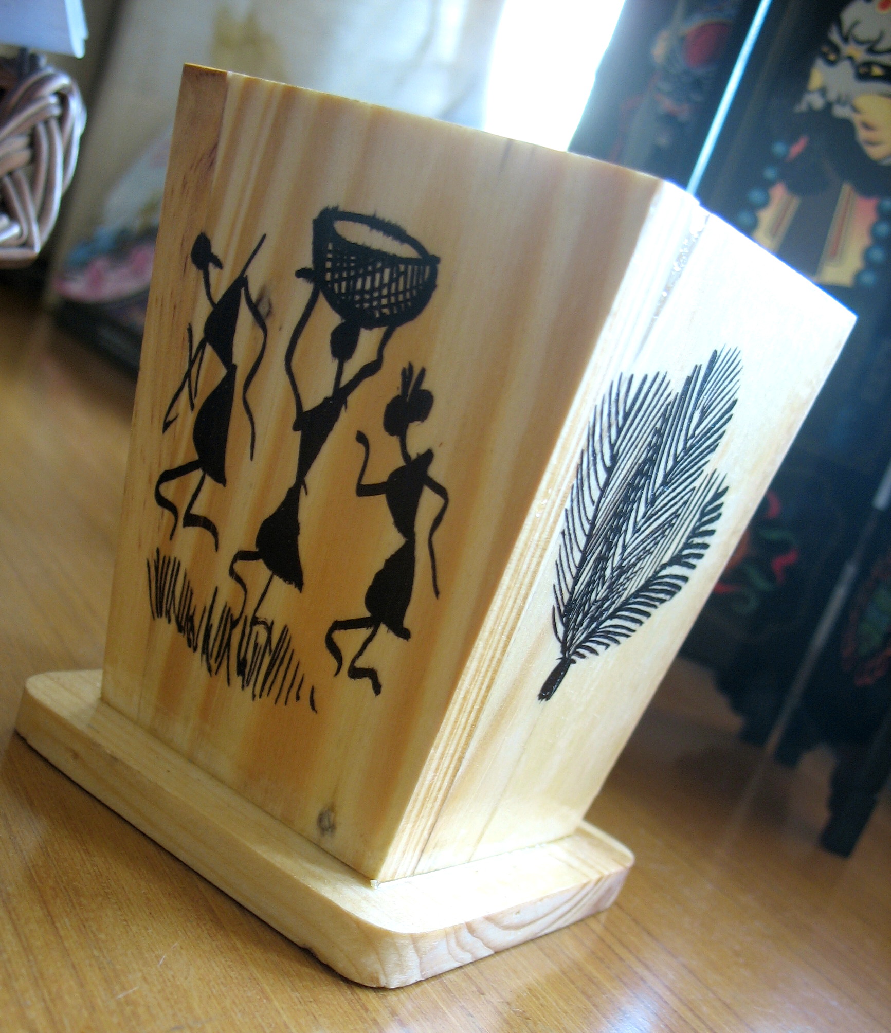 wooden pen-stand with warli drawings